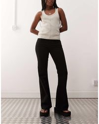 Weekday - Vaqueros Negros De Talle Bajo Y Corte Slim Bootcut Nova De -Azul - Lyst