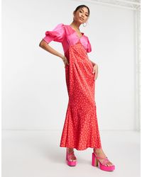 Never Fully Dressed - Vestido largo rosa y rojo con mangas abullonadas en contraste - Lyst