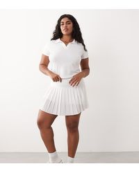 4505 - Curve Active Pleated Tennis Skirt With Inner Short - Lyst