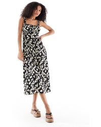 New Look - Robe mi-longue à bretelles fines et imprimé pâquerettes - Lyst