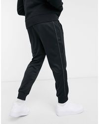nike repeat tape poly joggers