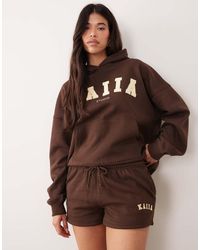 Kaiia - Studio Embroidered Logo Shorts - Lyst