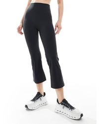 agon® - Capri Leggings - Lyst