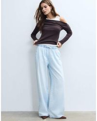 Stradivarius - Flowy Denim Trousers With Drawstring - Lyst