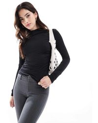 Stradivarius - Top A Maniche Lunghe Accollato Attillato - Lyst