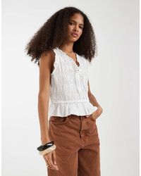 Gap - Sleeveless Tie Front Blouse With Ruffle Detail - Lyst