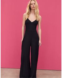 Stradivarius - Tuta Jumpsuit Morbida Nera Con Spalline Sottili - Lyst