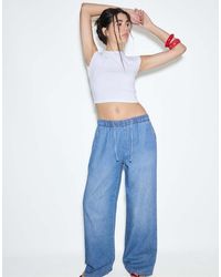 Stradivarius - Flowy Denim Trousers With Drawstring - Lyst