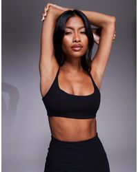 4505 - Yoga Twist Back Light Support Sports Bra - Lyst