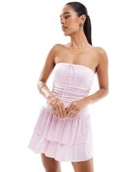 Hollister - Vestito Corto Rosa A Righe A Balze Allacciato Al Collo Con Gonna Pantalone - Lyst