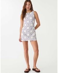 Stradivarius - – kurzes kleid mit stickerei - Lyst