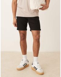 ASOS - Pantaloncini Di Jeans Slim Elasticizzati Lunghezza Normale Neri - Lyst