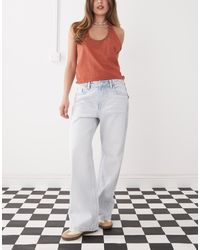 Monki - Vaqueros Azules Holgados De Talle Bajo Con Lavado Claro Missy De - Lyst
