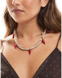 Accessorize - – e statement-halskette mit chili-anhängern und zierperlen - Lyst