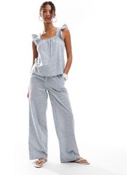 Pieces - Mix and match - pantalon ample en coton noué à la taille - rayé - Lyst