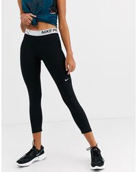 Nike Nike Pro Training Crossover Leggings In Black And Pink - Lyst