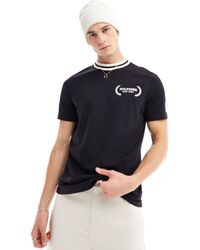 Tommy Hilfiger - T-shirt nera con colletto con righe a contrasto e logo - Lyst