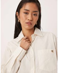 Calvin Klein - – gestreifte relaxed-fit-hemdbluse aus baumwoll-popeline - Lyst