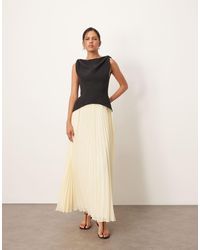 ARRANGE - Vestito Lungo Ibrido Nero Con Gonna A Pieghe Color Latticello E Spalline Attorcigliate - Lyst
