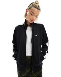 Nike - Streetwear - giacca sportiva nera con chiusura con zip - Lyst