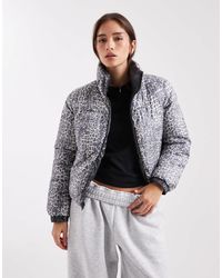 Pieces - – wendbare steppjacke mit farblich abgestimmtem leopardenmuster - Lyst
