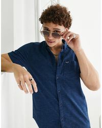 Uomo Abbigliamento da Camicie da Camicie casual e con bottoni Camicia a maniche corte con motivo astrattoMcQ in Seta da Uomo colore Blu 