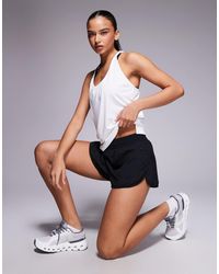4505 - Icon Woven Running Shorts With Zip Pockets - Lyst
