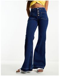 Wrangler - Jeans a zampa a vita alta con bottoni - Lyst