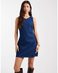 ASOS - Robe courte en jean à col montant en v - délavage brut - Lyst