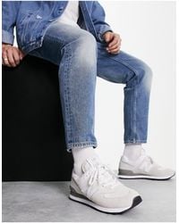 New Balance - 574 - sneakers sporco con dettagli grigi - Lyst