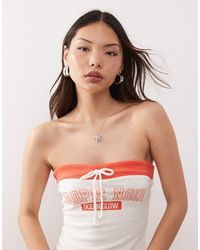 Monki - Co-ord Strapless Bandeau Jersey Top With Orange Contrast Tie Detail And 'tropic Noir' Varisty Print - Lyst