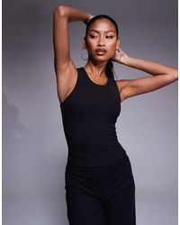 4505 - Icon Racer Back Vest With Inner Bra And Removable Padding - Lyst