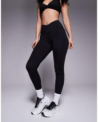 4505 - Leggings Negros Para Yoga Con Cinturilla Cruzada De Tejido Suave Icon De Hourglass - Lyst