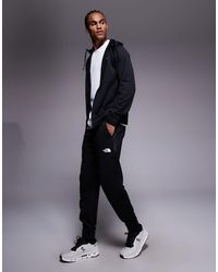 The North Face - Pantalones Negros De Felpa Mountain Athletics De - Lyst
