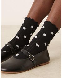 ASOS - Chaussettes à pois avec bordure à volants - et blanc - Lyst
