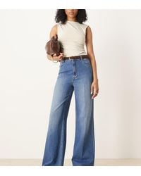 ASOS - Vaqueros De Pernera Ancha Con Lavado Medio Oscuro, Cinturón Y Detalle De Raya En La Parte Delantera De Asos Design Tall-Azul - Lyst