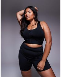 4505 - Curve Icon High Support Zip Front Sports Bra With Adjustable Straps And Removable Padding - Lyst