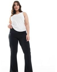 ASOS - Pantalones Negros De Campana Con Bajos Ondulados De Canalé De Asos Design Curve - Lyst
