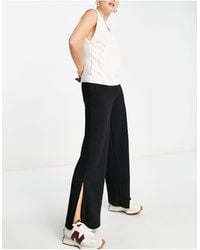 Y.A.S - Pantaloni con fondo ampio neri a righe glitterate - Lyst