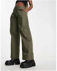 Monki - Pantaloni con fondo ampio color kaki - Lyst