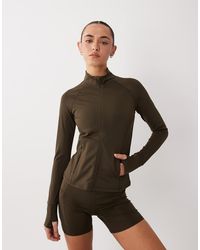 4505 - Icon Active Zip Up Sculpting Long Sleeve Jacket With Zip Pockets - Lyst