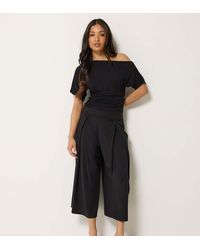 PixieGirl - Petite Pleated Cropped Wide Leg Trousers - Lyst