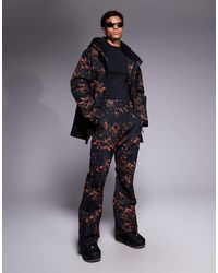 Threadbare - Pantaloni Da Sci Neri Con Stampa Arancione - Lyst