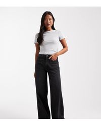 ASOS - Vaqueros Negros De Pernera Ancha Y Talle Alto Con Bolsillos Delanteros De Asos Design Petite - Lyst