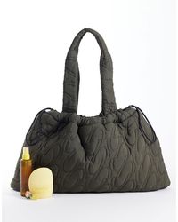 4505 - Woven Logo Quilted Tote With Adjustable toggle - Lyst