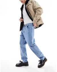 Carhartt - – newel – schmal zulaufende jeans - Lyst