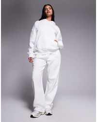Kaiia - Cotton Rich Embossed Logo Wide Leg jogger Co-ord - Lyst