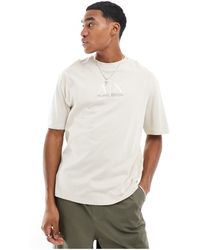 Armani Exchange - T-shirt comfort fit beige con logo centrale sul petto - Lyst