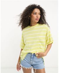 ASOS - Camiseta extragrande a rayas amarillas y blancas con aberturas laterales - Lyst