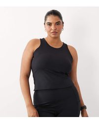 4505 - Curve Icon Active Racer Back Vest With Inner Bra And Removable Padding - Lyst